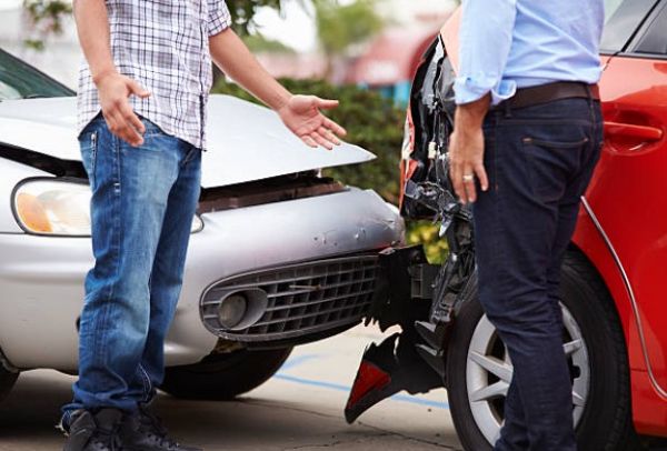 Car accident lawyer reviewing crash scene evidence .