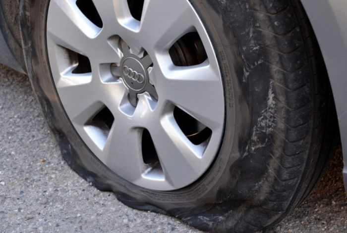 Blown-out tire on a hot Miami road from extreme heat causing a car accident