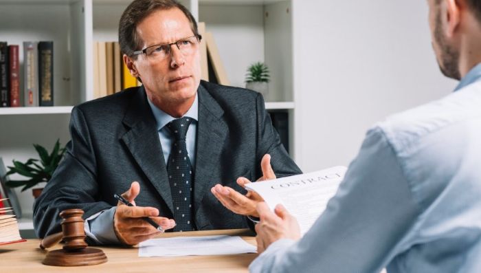 Client meeting with a Miami car accident lawyer to discuss accident case.