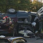 Car accident on a wet road due to poor weather.