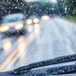 Car driving through heavy rain in Miami with increased car accident risk